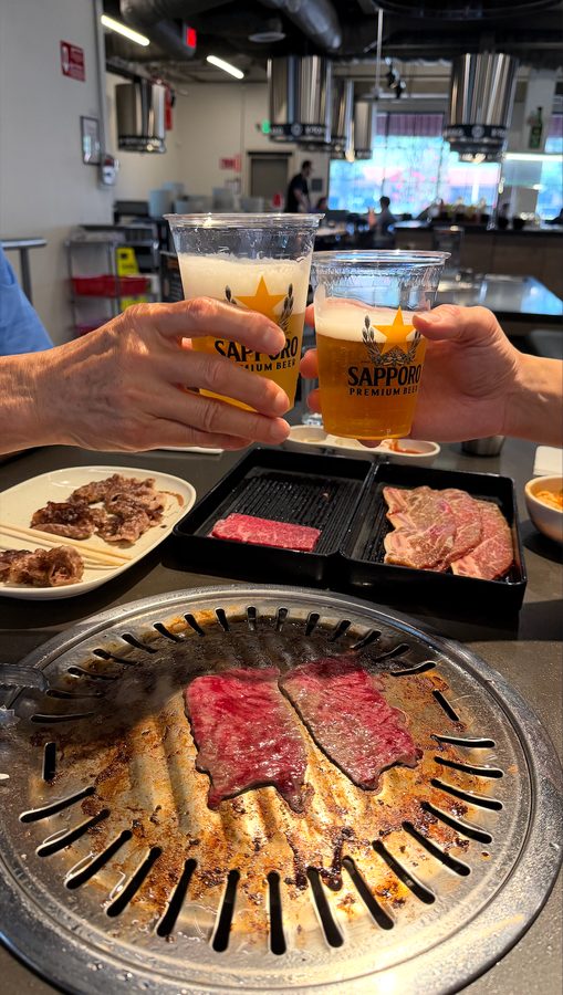 Guests toasting over the grill at K-Top